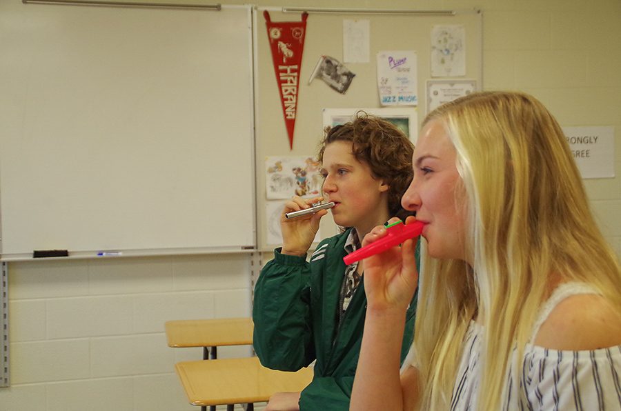 Kaisa Whittaker ‘21 and Katie Hoefer ‘21 kick off a kazoo club meeting on December 4 with some helpful breathing exercises.