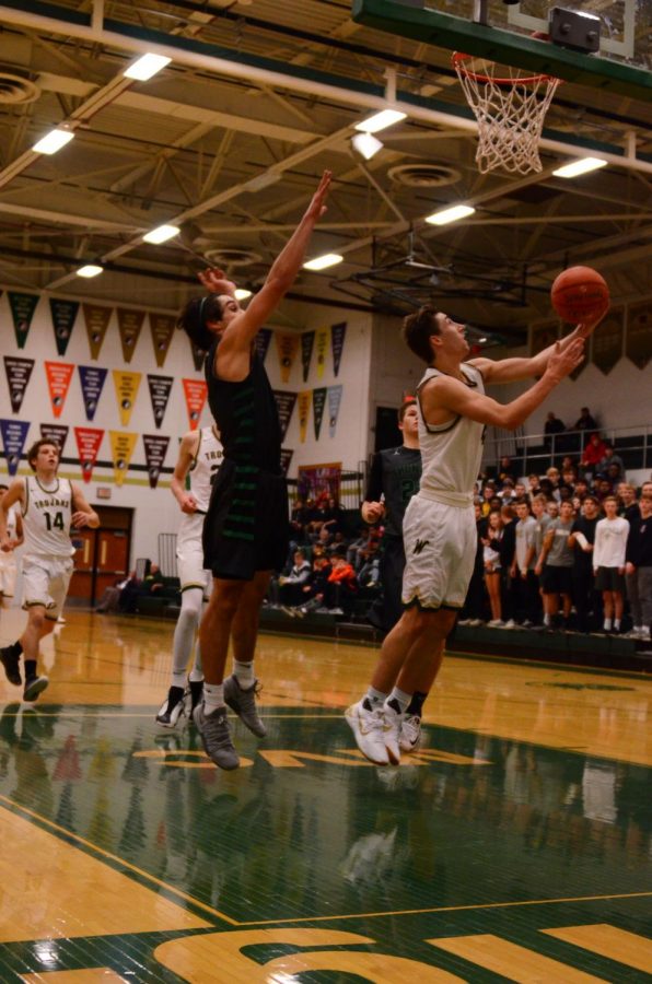 Brayden Adcock '19 takes a reverse layup on Saturday, Dec. 1.