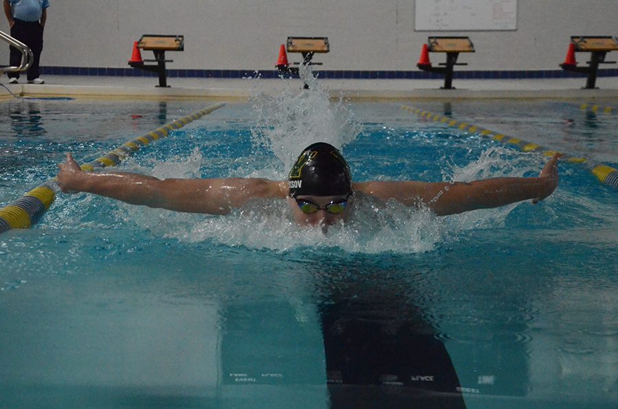 Val Trussov 19 swims butterfly during practice, which he considers to be his best stroke.