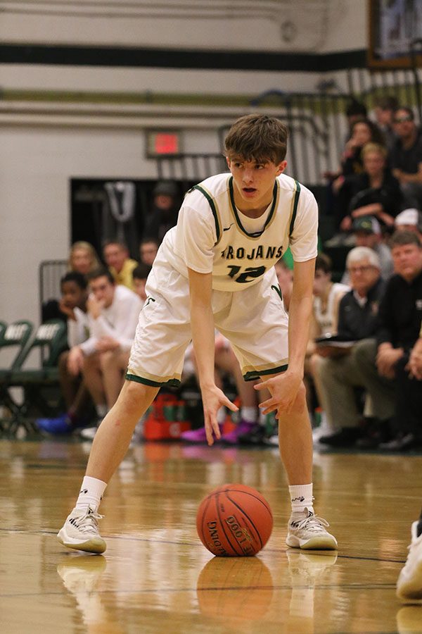 Joey Goodman '20 dribbles the ball back and forth between his hands as he waits for the clock to count down during the first half on Friday, Jan. 4.