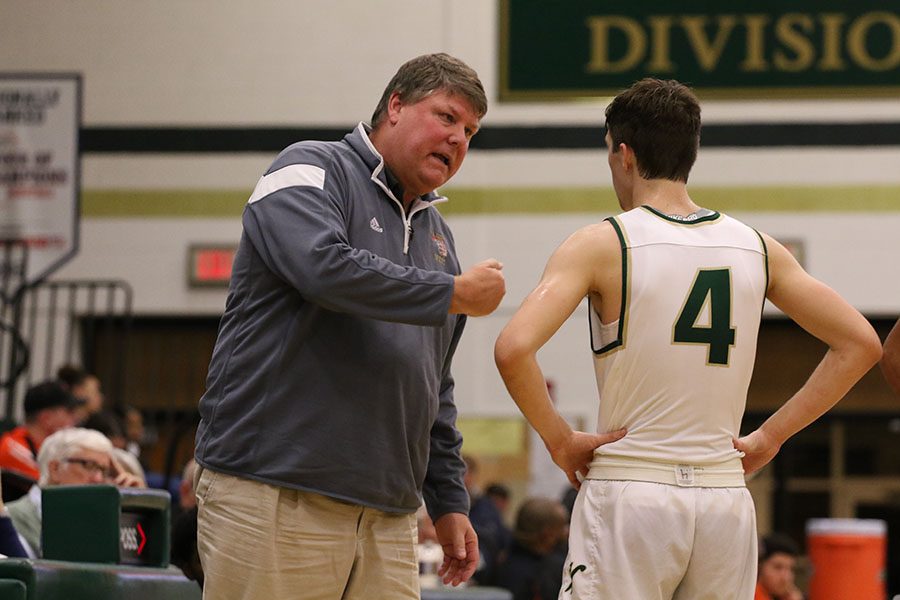 Head coach Steve Bergman talks to Brayden Adcock '19 during the second half on Tuesday, Jan. 15.