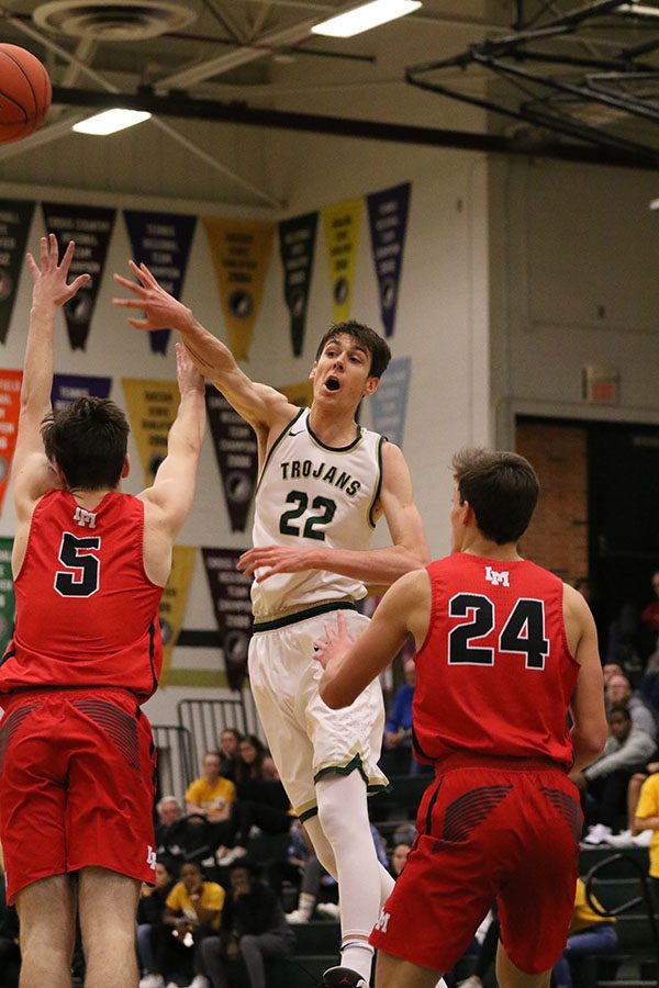 Patrick McCaffery 19 finds an opening and passes the ball to the other side of the court during the second half on Friday, Jan. 4.