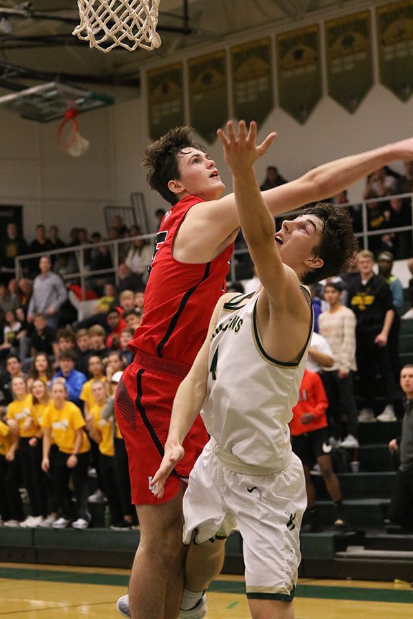 Brayden Adcock 19 goes up for a layup as Linn-Mars Jaren Nelson 19 swats it out of the way during the second quarter. A foul was called on the play and Adcock was able to go to the line for West and score two points on Friday, Jan. 4.