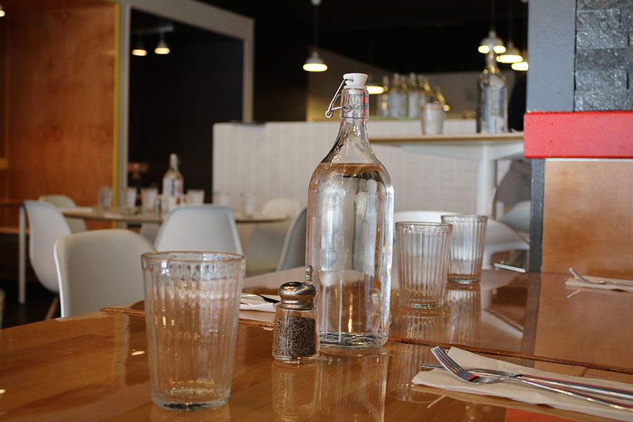 Every table has a bottle of water waiting for the customers to arrive. Refills are served as needed.