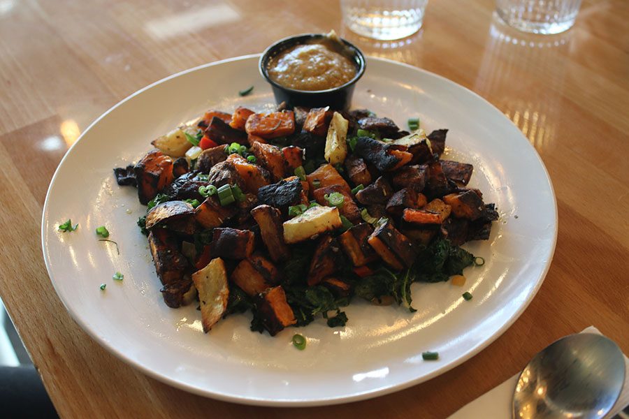 The Power Plant features seasonal vegetables served over sautéed greens.
