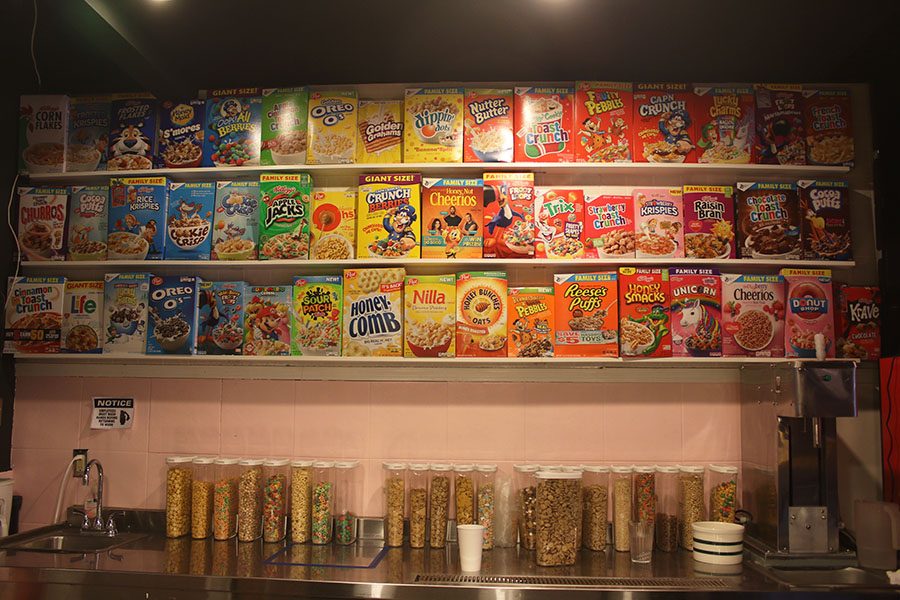 Over 50 flavors line a wall at Melk. They mix the shakes and pour their cereal bowls here. 