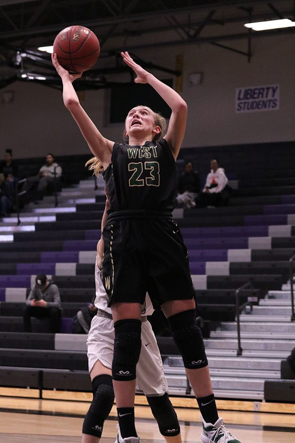 Audrey Koch 21 jumps up for a layup during the first half on Friday, Jan. 25.