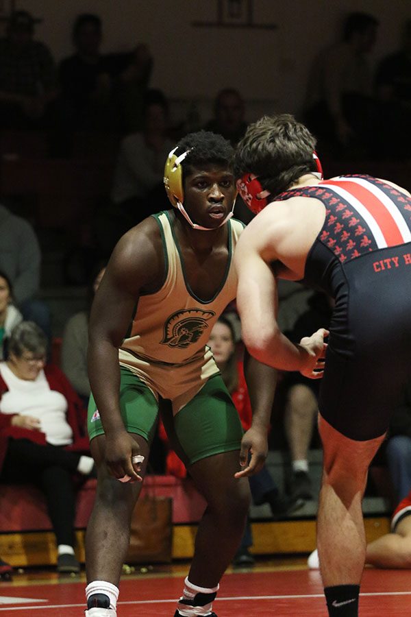 Jo Dixon '19 stares down his opponent, Brandon Lalla '19 during their match on Thursday, Jan. 3.