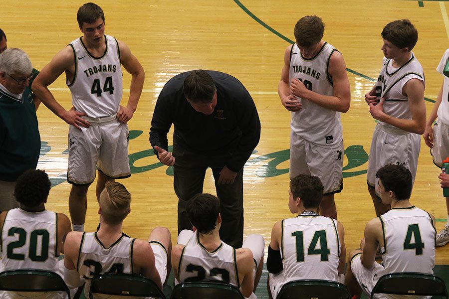Head coach Steve Bergman talks to Marcus Morgan 21, Even Brauns 20, 	Patrick McCaffery 19, Nick Pepin 20 and Brayden Adcock 19 in between the third and fourth quarters on Friday, Jan. 25.
