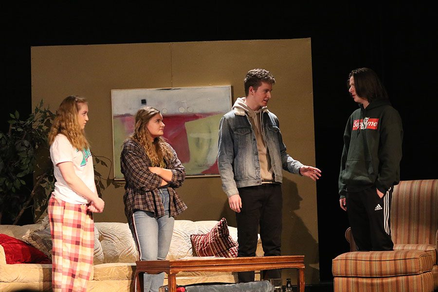 Marijke Nielsen '19, Hanna O'Dell '19, Sean Harken '21, and Cyrus Yoder '20 debate with each other on stage during the drama play "The end summer" on Thursday, Jan. 10