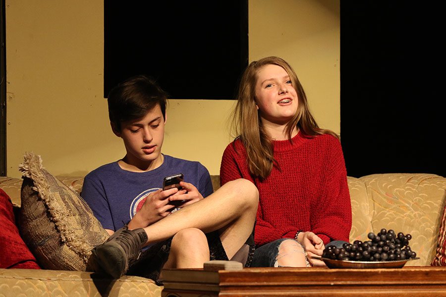 Evan Zukin 22 plays on his phone while Samantha Croco 22 gets into character during their scene in Its not you, its me on Thursday, Jan. 10.