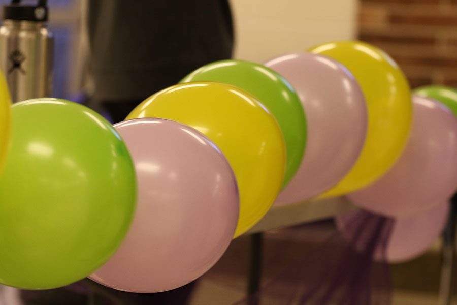 Green, purple and yellow balloons decorate the commons during the hair drive on Friday, Jan. 11.