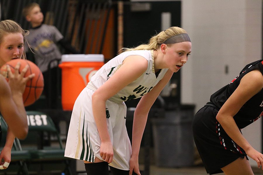 Sydney Allen '19 watches a player from Linn-Mar get ready to shoot a free throw during the first half on Friday, Jan. 4.