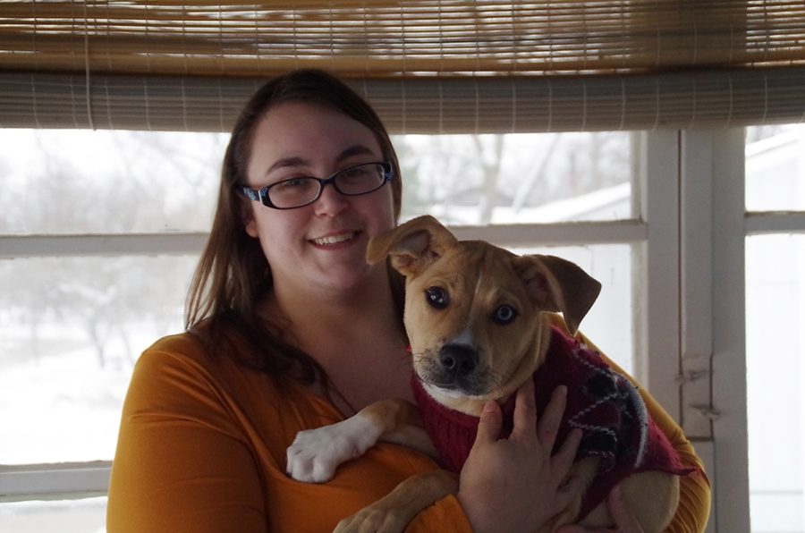 Jennifer Craig and Dante the dog pose for a photo on Sunday, Jan 13. at their new house, bought on Saturday, Jan 12.