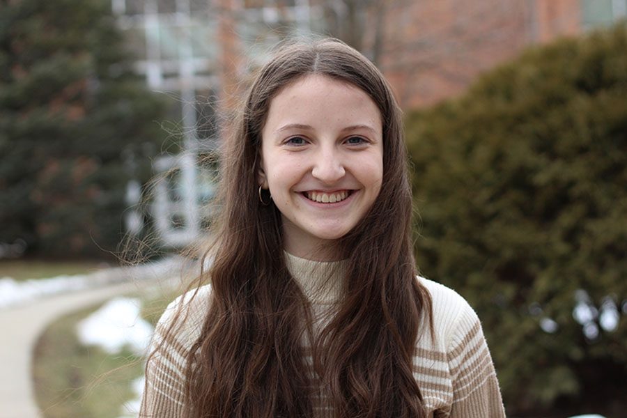 Guest columnist Sumner Wallace '20 smiles for a portrait in the West High courtyard. She writes about the need for communication in her piece.