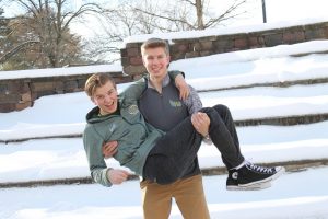 Eric Doorn 19 holds Dylan  Gesell 19 in the courtyard on Valentines Day. 