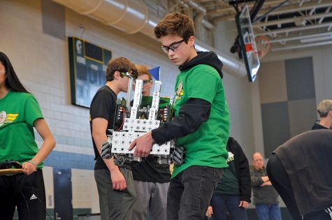 Ivan Badovinac 19 carries the robot off the field during the qualifying matches of the Super Qualifiers on February 9. 