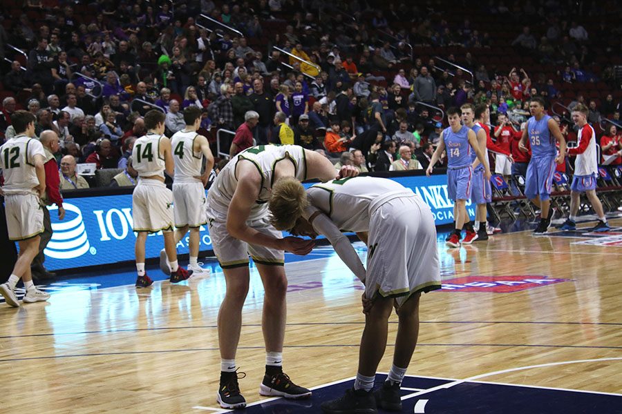 Even Brauns 20 consoles Marcus Morgan 21 after they were defeated by Dubuque Senior 36-39 on Wednesday, March 6.