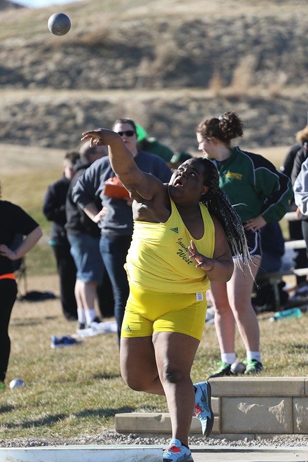 Salima Omari 20 takes her first throw of the night on Tuesday, March 26. Omari placed second in the shot put with a throw of 38-8 1/2.