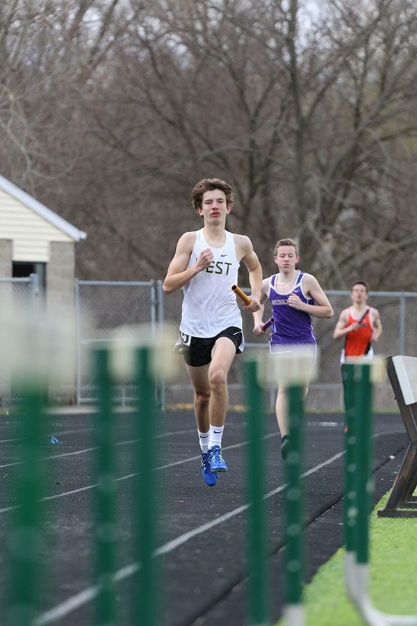 Caden Noeller 22 runs the final leg of the 4x800 meter relay on Saturday, April 13. The relay team placed second in 8:31.15.