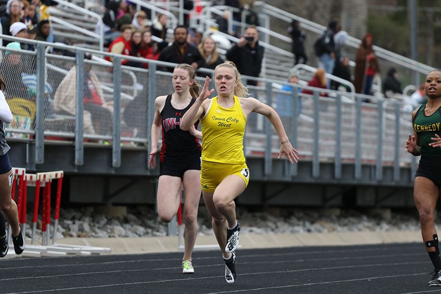 Peyton Steva 19 leads during her heat of the 100 meter dash. Steva placed first in 12.63 on Thursday, April 18.