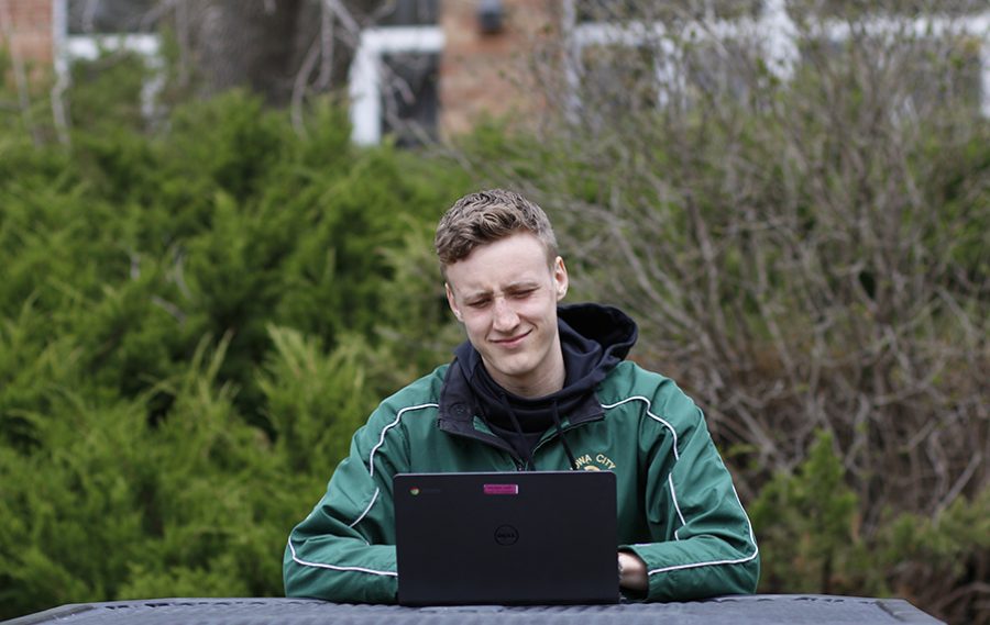 Ken Wilbur '20 frowns as he reads an email about the  ISASP testing schedule.