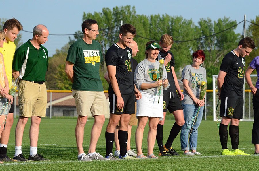 Joey Kuehn '19 stands with his parents.