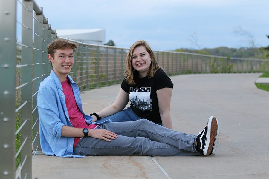 Will Conrad 19 and Lucy Polyak 19 pose together in their casual outfits on a walkway downtown Iowa City on Sunday, May 5.