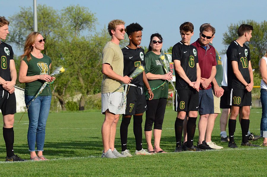 Gada Ambo '19, aside his brother, smiling about a joke his coach made. 