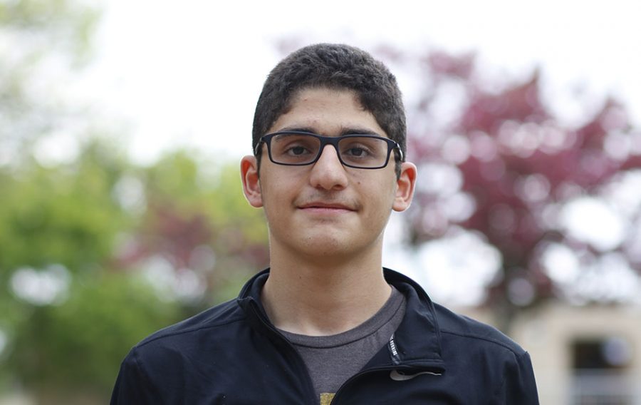 Kareem Shoukih 20 poses for a photo in the West High courtyard on May 6, 2019.
