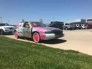 The car was fined for obstruction of view because of the spray paint the used car was covered in. 