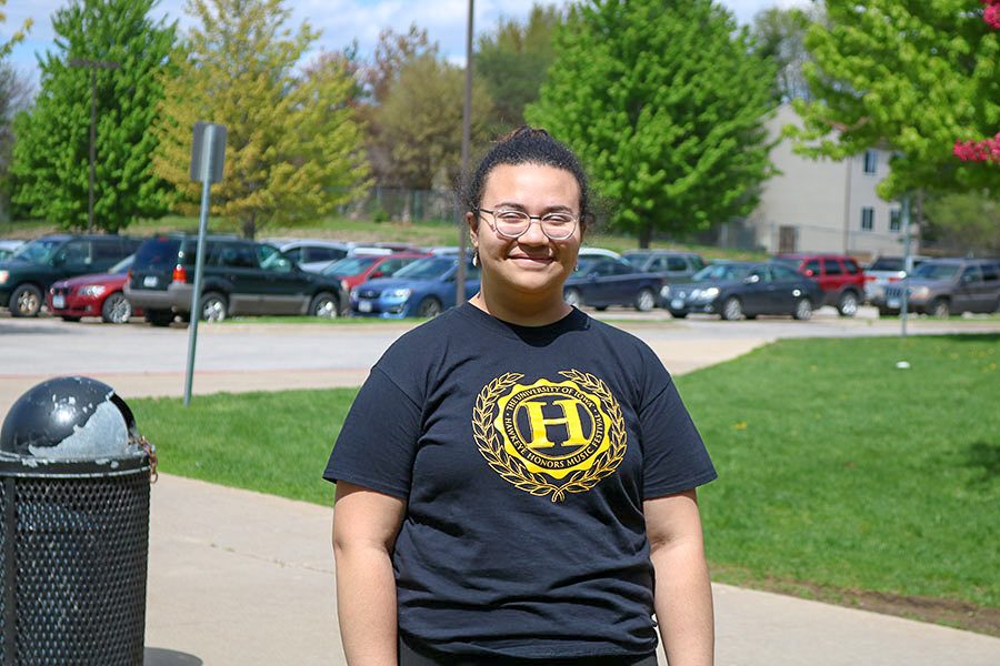 Lilian Montilla ‘21 poses for a photo outside the auditorium doors on May 10th.