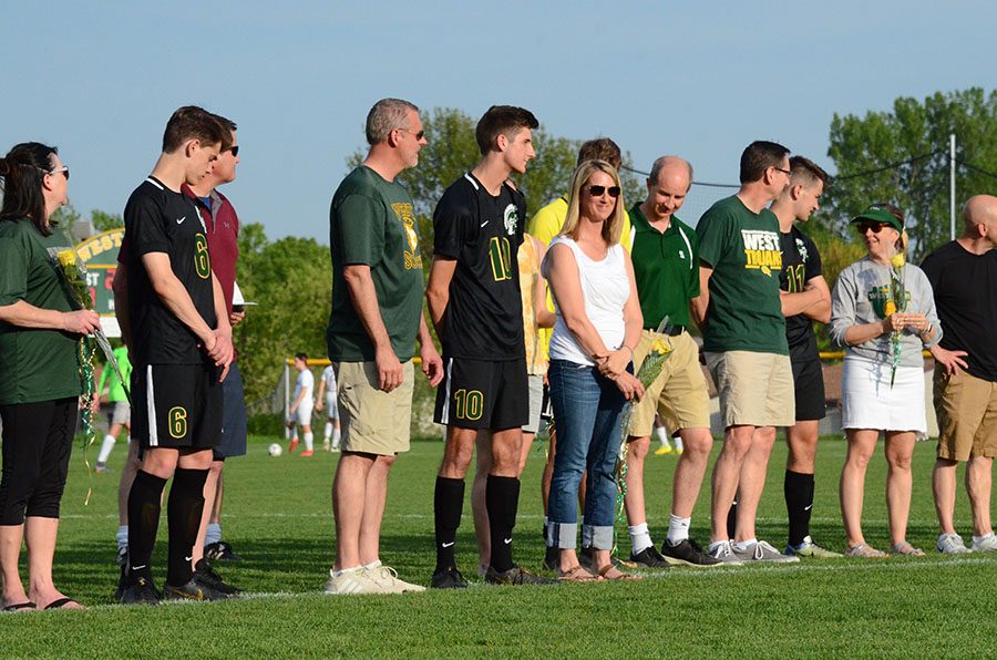 Matthew Mcdonnell '19 stands by his parents.