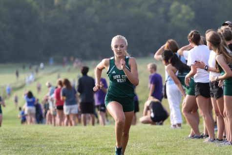 Katie Hoefer 21 fights towards the finish line during the 2018 Earlybird Invite at the Ashton Cross Country Course on Aug. 23.