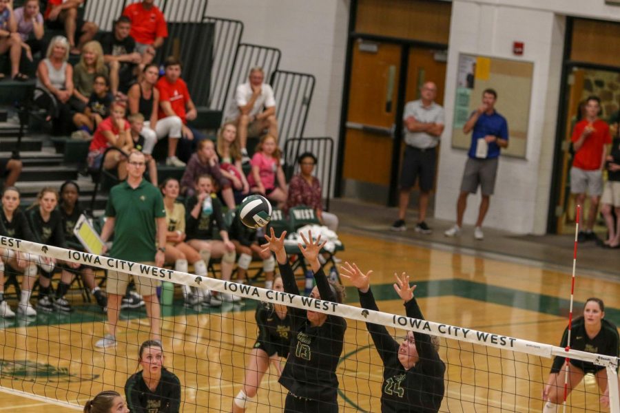 Misha Canin '22 and McKenna Proud '21 reach for a block on Tuesday, August 27 during the Battle for the Spike.