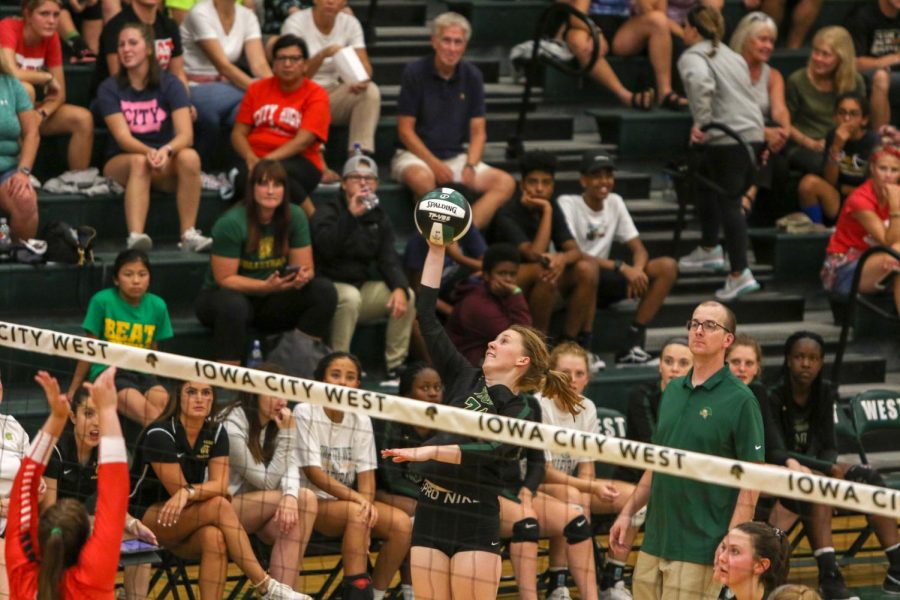 Raina Pfeifer '22 reaches back to hit the ball on Tuesday, August 27 during the Battle for the Spike.