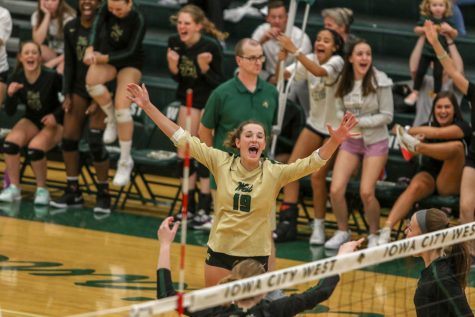 Katherine Kouba 22  celebrates a point with her teammates on Tuesday, August 27 during the Battle for the Spike.