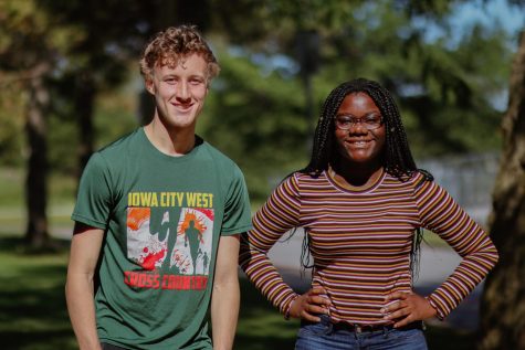 Ken Wilbur 20 and Mami Selemani 20  pose for a photo on the front lawn after finishing their podcast. 