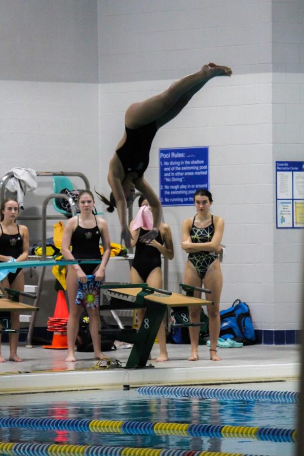 Austyn Goodale 20 executes a dive during the girls home sweet meet at the Coralville Recreation Center on Sept. 17. Goodale won the diving competition with a score of 211.65