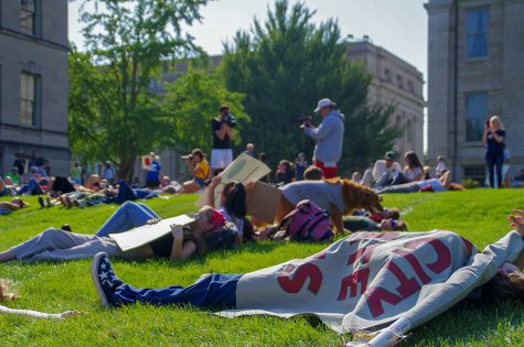 Students from all over Iowa City participate in an 11 minute die-in. The 11 minutes symbolize the estimated 11 years we have until the earth reaches its tipping point.