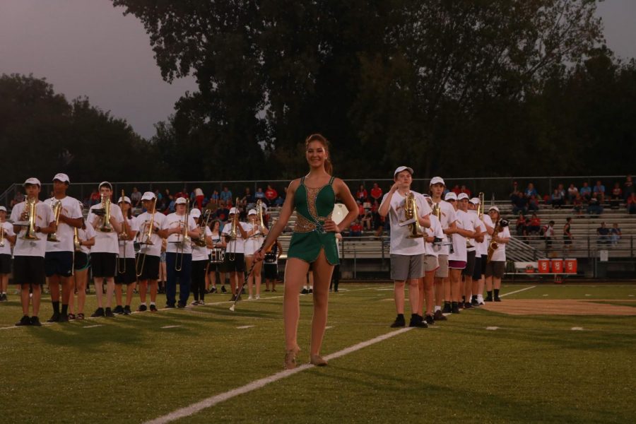 Lizzy Slade 21 striking a pose after marching onto the field with the band.