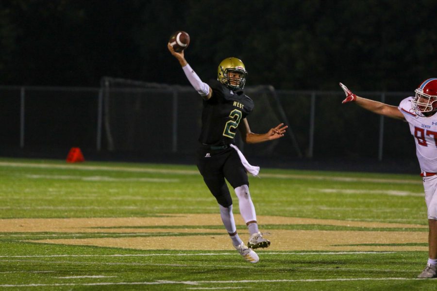 Marcus Morgan '21 throws for a first down on Sept. 20 during the game at Trojan Field.