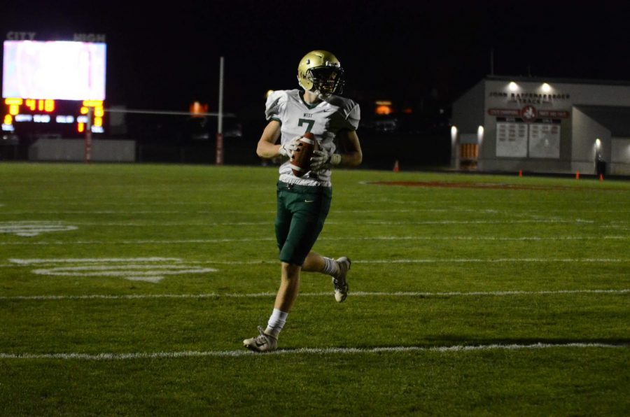 Grant Henderson '20 walks into the end zone for a two-point conversion in the second quarter of the Battle for the Boot at Bates Field on Oct. 25.