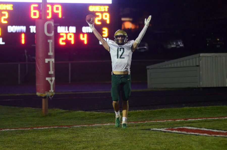 Grahm Goering '21 celebrates his fourth-quarter touchdown which gave the Trojans a 36-32 lead in the Battle for the Boot at Bates Field on Oct. 25.