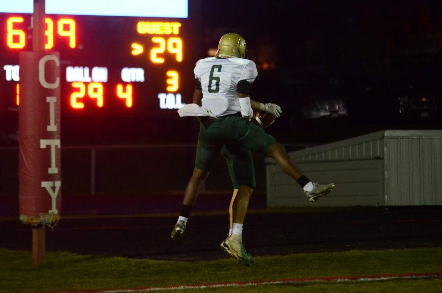 Mikey Brown '21 and Grahm Goering '21 celebrate following Goering's fourth-quarter touchdown in the Battle for the Boot at Bates Field on Oct. 25.