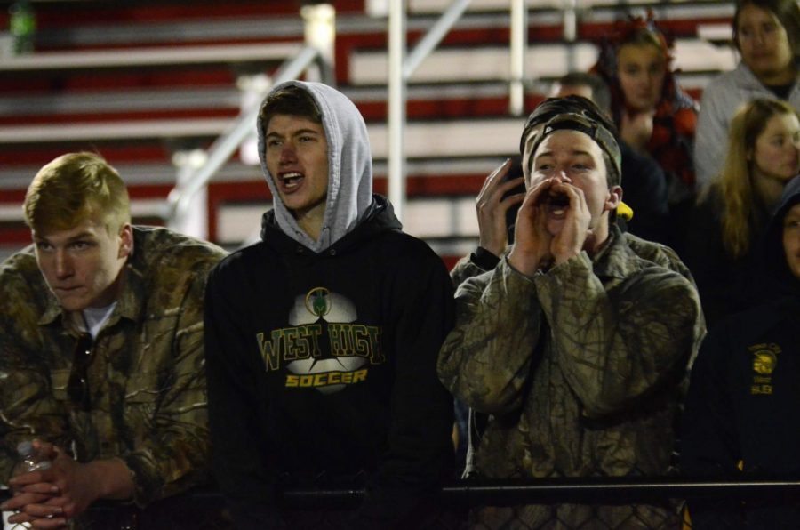 Superfans Even Brauns '20, Alec Murley '20 and Collin Leavy '20 create noise during a third-down play at Bates Field on Oct. 25.