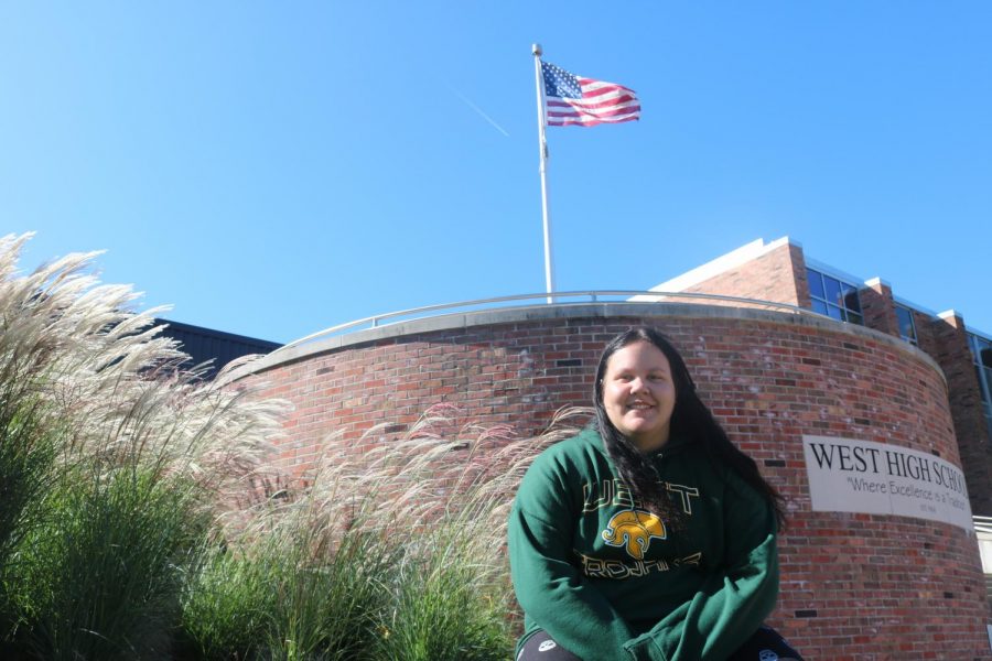 Aislin Craig 21 sitting outside of West High enjoying the beautiful weather before it starts to get cold.