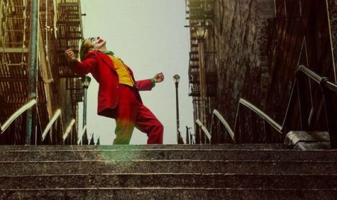 Joker (Joaquin Phoenix) dances down a staircase in an iconic scene from the film