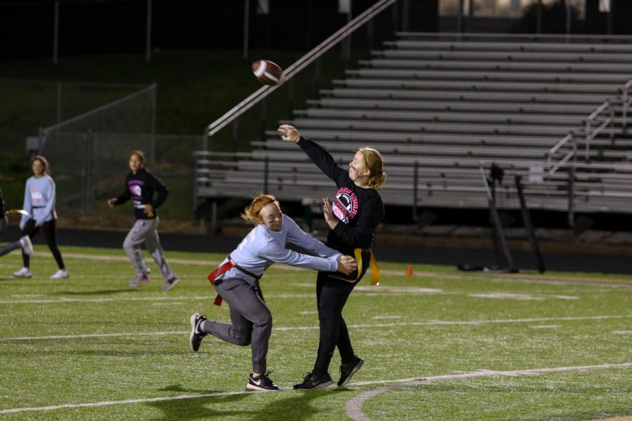 Kaitlyn Hillberry '20 throws under pressure during West High's annual powderpuff game on Oct. 3rd. 