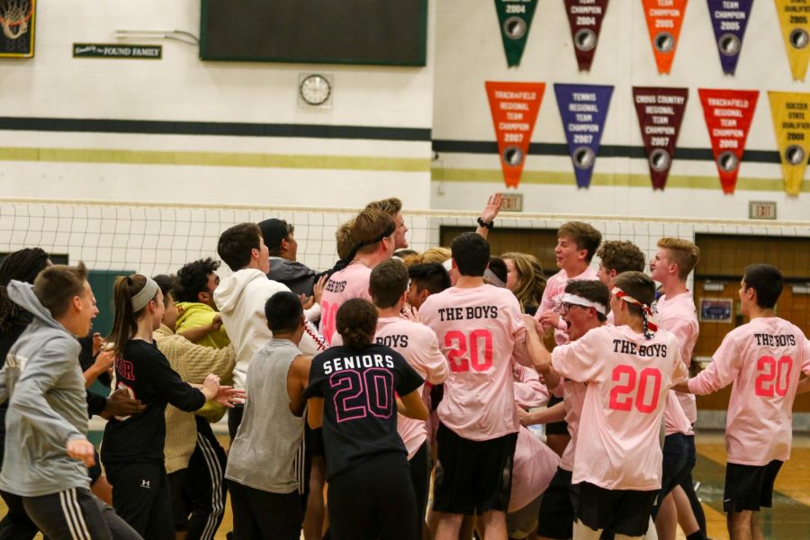 The seniors rush the court to celebrate after defeating the juniors during West High's annual man ball game on Oct. 3rd. 